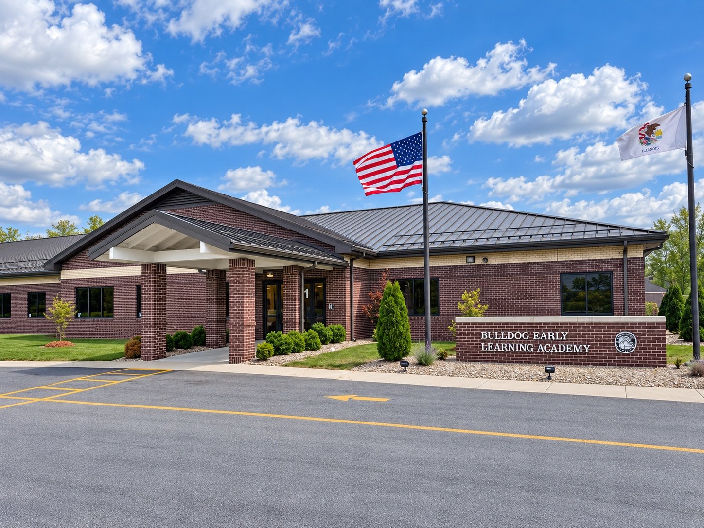 Bulldog Early Learning Academy entrance, brick signage, and American and Illinois flags